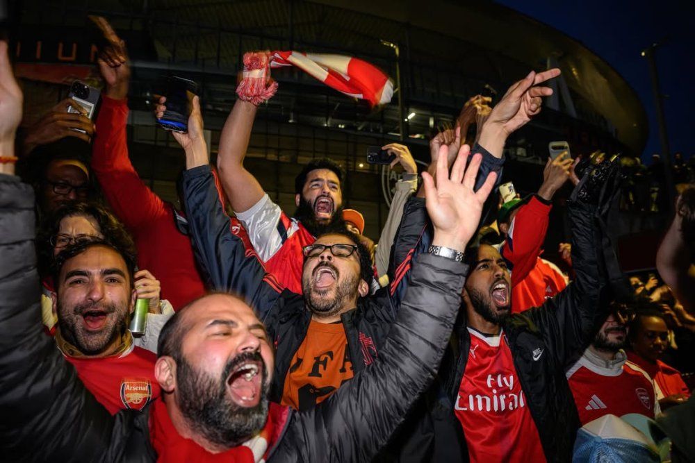 english_media_personality_and_former_arsenal_footballer_ian_wright_celebrates_with_supporters_at_7_-73678.jpg