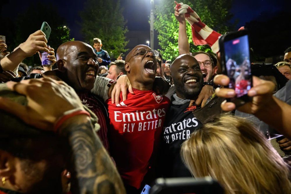 english_media_personality_and_former_arsenal_footballer_ian_wright_celebrates_with_supporters_at-b311c.jpg
